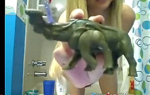 Blonde teen gets naked in the bath