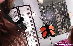 Classy trans fucks and facializes a redhead