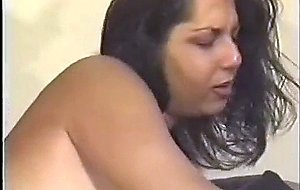 Tranny with big boobs fucks on the black sofa