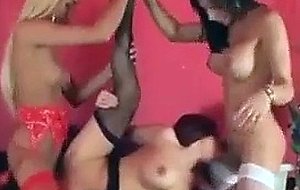 Two shemales and tart in white, black and red lingerie