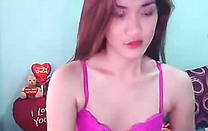 Tranny strokes her cock on the bed
