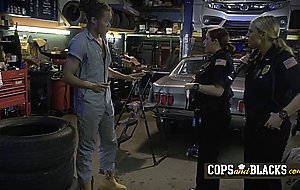 Mechanic dude gets surprised with two horny cops that want his cock instead of arresting him