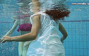 Hotly dressed teens in the pool