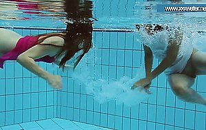 Hotly dressed teens in the pool