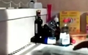 Emo teen fingers her pussy in kitchen