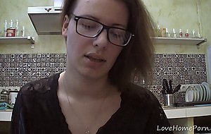 Solo girl with glasses chatting in the kitchen