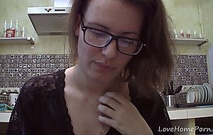 Solo girl with glasses chatting in the kitchen