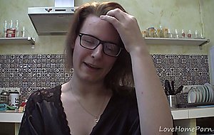 Solo girl with glasses chatting in the kitchen
