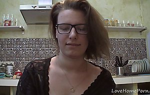 Solo girl with glasses chatting in the kitchen