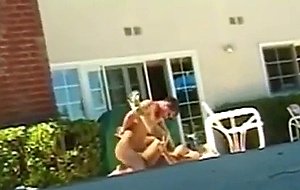 Horny young blonde with beautifull tits drops to knees and gives head by pool