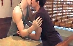 Handsome college guys lick each...