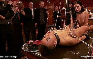Ebony slave holding heavy padlocks