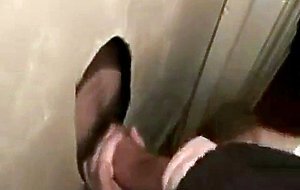 Hot sucking action at the homemade glory hole 6