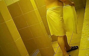 Naked men in public pool shower