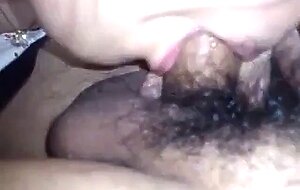 Japanese babe sucks her man's hairy cock