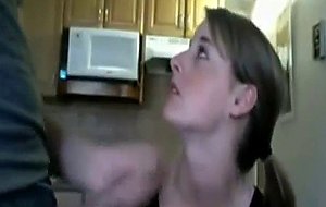 Young wife gives head in the kitchen
