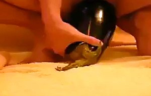 Amateur girl fucks eggplant