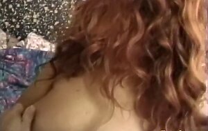 Sensual redhead Marisella teases and toys her pussy