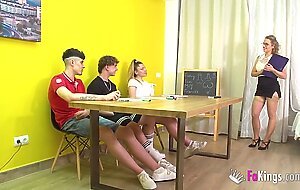 Experienced MILF teacher shows 3 teens how to fuck a woman