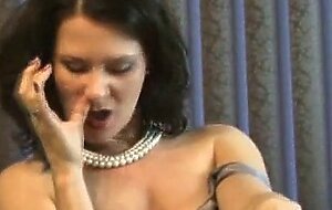 Sexy MILF puffs on a cigarette