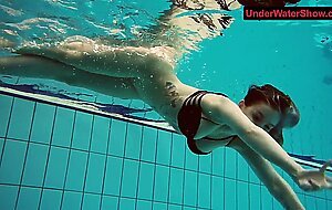 Tattooed baby swirls underwater