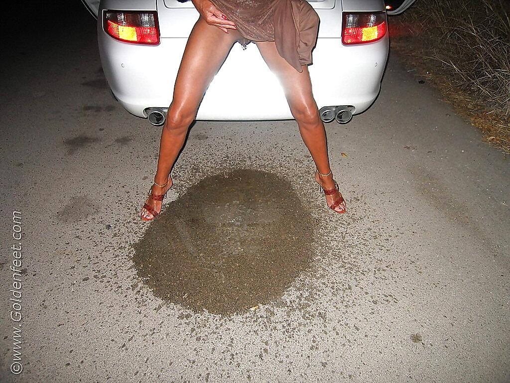 Naughty British woman Lady Sarah and her pierced twat taking piss on floor
